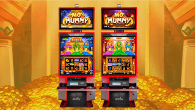 Pile of coins with Mo' Mummy VLT machine.