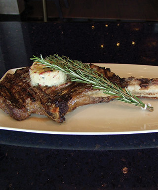 Tomahawk Steak on white plate